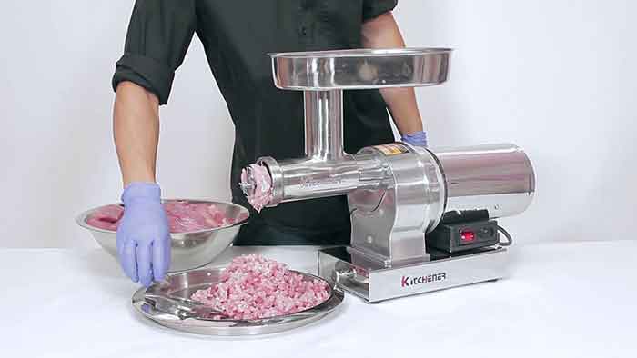 grind meat using electric meat grinder